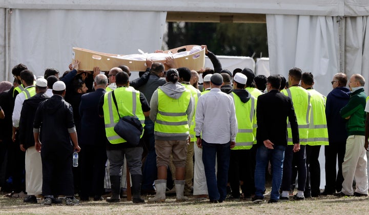 Mourners carry the body of a victim from last week’s mosque shooting for a burial at the Memorial Park Cemetery in Christchurch, New Zealand.