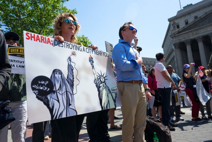 Anti-Muslim activists, like those seen here in New York City in 2017, spread the myth that Muslims are imposing "creeping Shariah" on the United States as part of an un-American agenda.