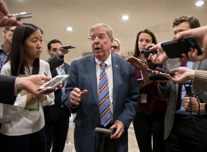Sen. Johnny Isakson (R-Ga.), shown here taking questions from reporters at the Capitol in 2017, on Wednesday became of one of the very few prominent Republicans willing to directly scold President Donald Trump for continuing to lash out at the late Sen. John McCain (R-Ariz.)
