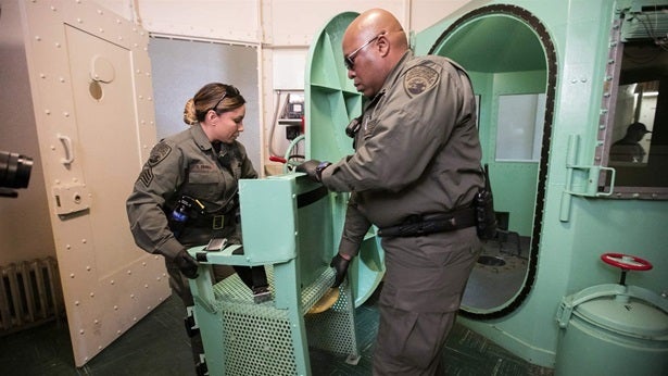A chair is removed from the death penalty chamber at California’s San Quentin State Prison this month after Democratic Gov. G