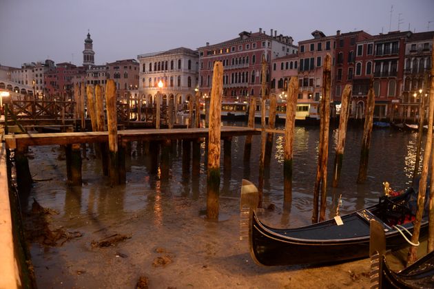 Gondolas are seen tied up in Venice Canal Grande, near Rialto bridge, on January 31, 2018, as exceptionally...
