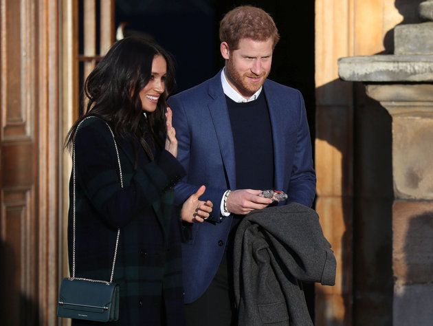 Britain's Prince Harry and his fiancee Meghan Markle attend a reception for young people at the Palace...