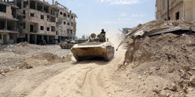 Des soldats de l'armée syrienne à Douma en Syrie le 8 avril
