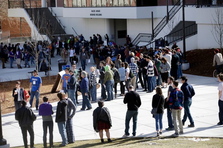 People line up to participate in the Democratic caucus at the University of Nevada in Reno. Nevada Democrats are proposing major changes to their presidential caucuses.