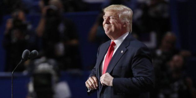 U.S. Republican presidential nominee Donald Trump adjusts his jacket while speaking at the Republican...