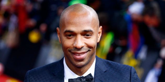 Former French player Thierry Henry arrives for the FIFA Ballon d'Or 2014 soccer awards ceremony at the...