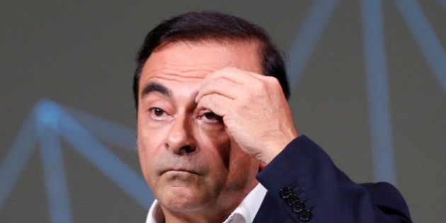Carlos Ghosn, Chairman and CEO of the Renault-Nissan Alliance, gestures during the presentation of the...