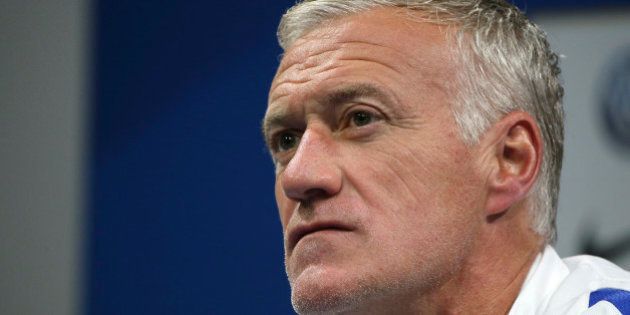 France's national soccer team coach Didier Deschamps reacts during a news conference at the team training...