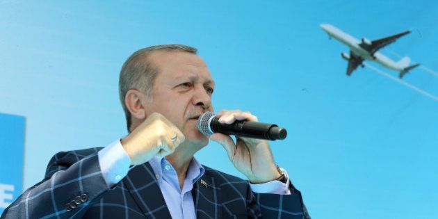Turkish President Tayyip Erdogan makes a speech during a ceremony at the airport in the Kurdish-dominated...