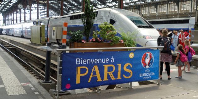 A welcoming banner for the Euro 2016 Championship is seen at the Gare de Lyon railway station in Paris,...