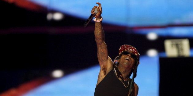 Rapper Lil Wayne performs during the 2015 iHeartRadio Music Festival at the MGM Grand Garden Arena in...