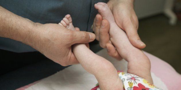 Osteopathic Treatment of Infant (Photo by: BSIP/UIG via Getty