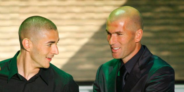 Lyon's Karim Benzema, left, reacts after he was voted 'best soccer player' of France's League One as...