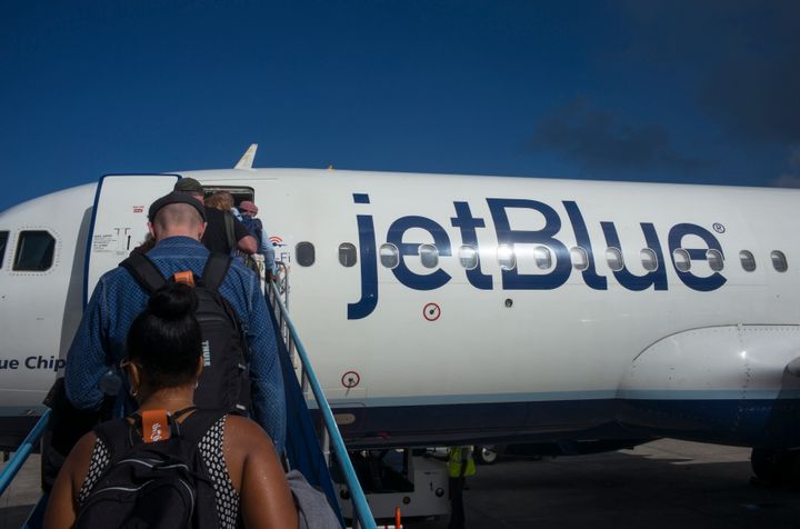 Passengers board a JetBlue flight.