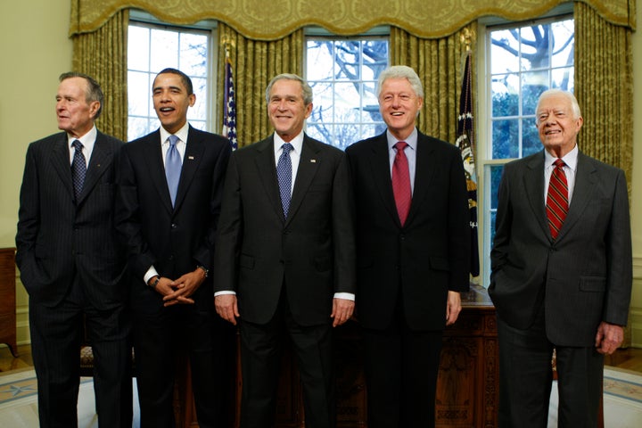 Former President Jimmy Carter (far right) joined other White House occupants for a photo in early 2009, just before Barack Ob