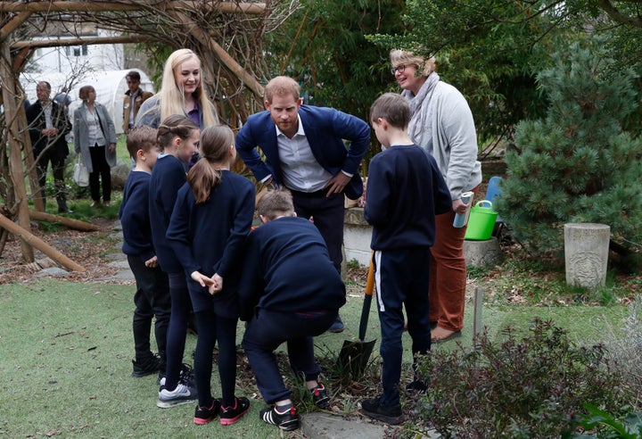 Goofing around during the tree-planting exercise.
