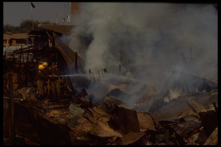 Firemen battling blazes set by Hindu mobs burning Muslim homes in rioting sparked by razing of Babri Mosque. 