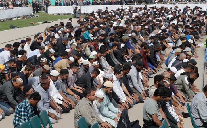 Muslims pray during Friday prayers at Hagley Park in Christchurch, New Zealand