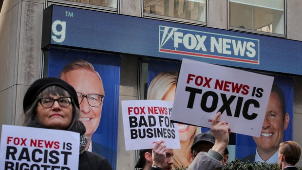 Protesters gather outside of Fox News and the News Corporation building in New York, U.S., March 13, 2019. REUTERS/Brendan McDermid