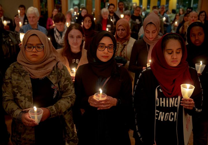 From left: Syeda Sabeera, Sumaiya Syed and Amina Choudhury stand with candles during a prayer service at St. James Episcopal Church on March 16 in Austin, Texas. The service was held in honor of those killed and injured in last Friday's mass shootings at two mosques in Christchurch, New Zealand.