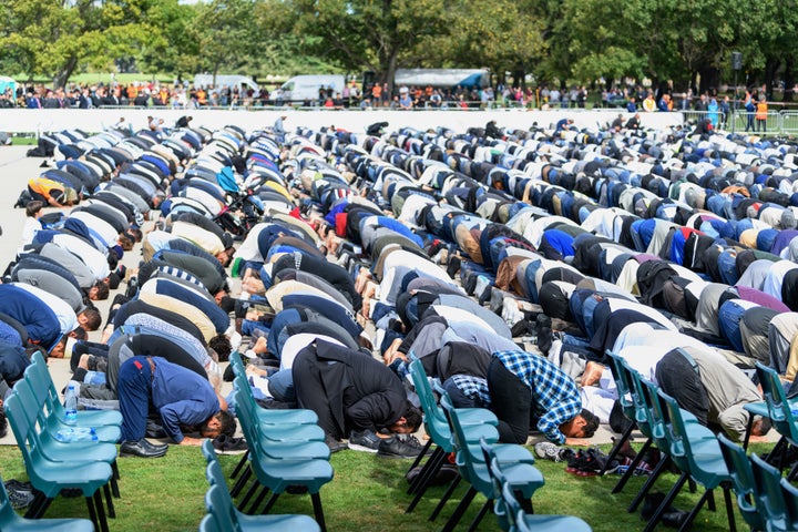 Members of the Muslim community participate in Friday prayers at Hagley Park, near Al Noor mosque, on March 22, 2019 in Christchurch, New Zealand. 