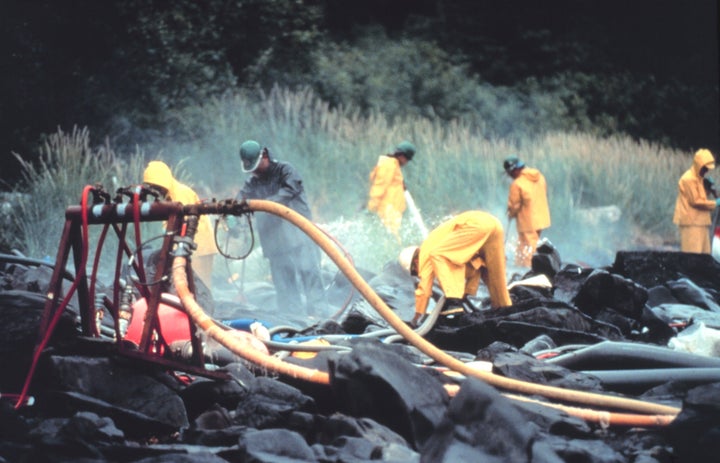 <p>Pressure cleaning rocks in the aftermath of the spill near Prince William Sound, Alaska. </p>