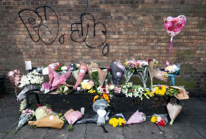 Floral tributes and messages left on the bench where university student Libby Squire was last seen alive, in Hull Yorkshire, after her body was found in the Humber Estuary