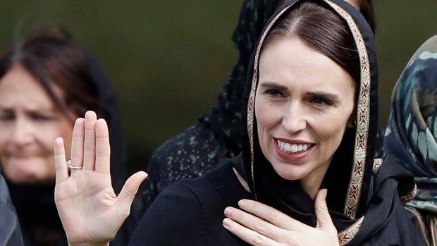 New Zealand Prime Minister Jacinda Ardern, second right, waves as she leaves Friday prayers at Hagley Park in Christchurch, New Zealand, Friday, March 22, 2019. People across New Zealand are observing the Muslim call to prayer as the nation reflects on the moment one week ago when 50 people were slaughtered at two mosques. (AP Photo/Mark Baker)