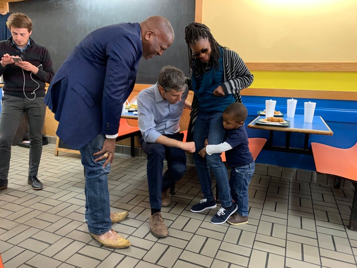 O'Rourke greets a toddler at Drake's Duck-In, where he met with Columbia Mayor Steve Benjamin.