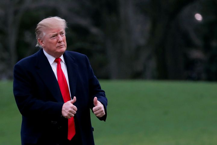 President Donald Trump reacts as he returns to the White House after Attorney General William Barr reported to congressional leaders on the special counsel's report on March 24, 2019. 