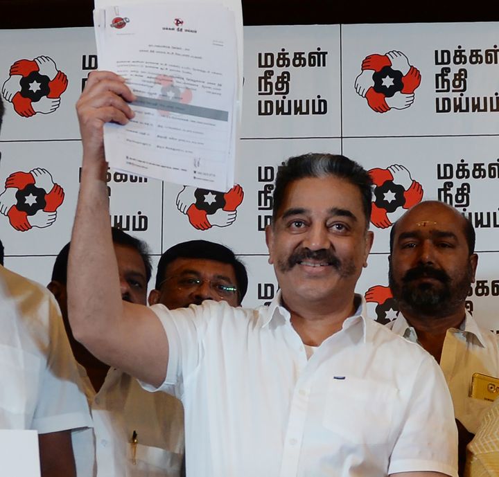 Actor and founder of 'Makkal Needhi Mayyam' party Kamal Hassan displays a candidates list during the candidates introduction event ahead of the general elections, in Chennai on March 20, 2019.