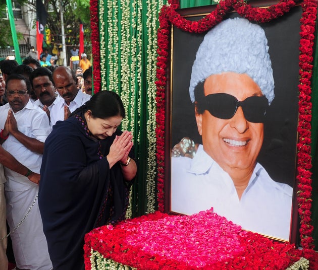 J Jayalalithaa of the All India Anna Dravida Munnetra Kazhagam (AIADMK) visits a portrait of party founder...
