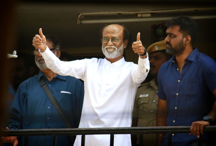Rajinikanth gives thumbs up sign to his fans after announcement to launch his own political party, in Chennai, India, Sunday, Dec. 31, 2017. 