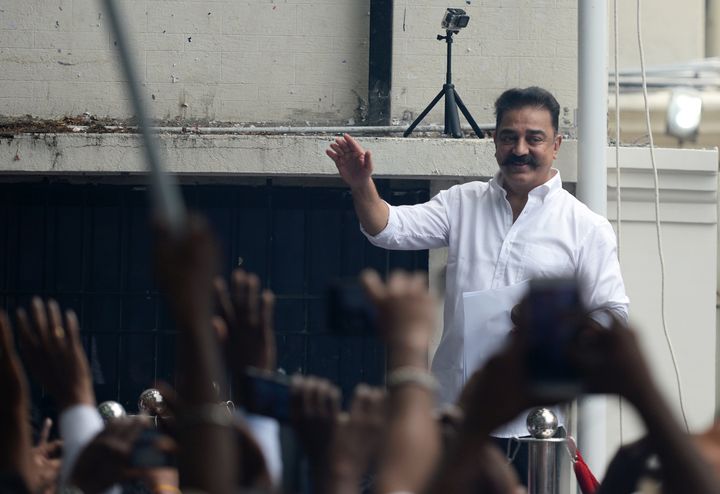 Kamal Hassan gestures as he addresses activists and supporters at his 'Makkal Needhi Mayyam' political party's office in Chennai on July 12, 2018.