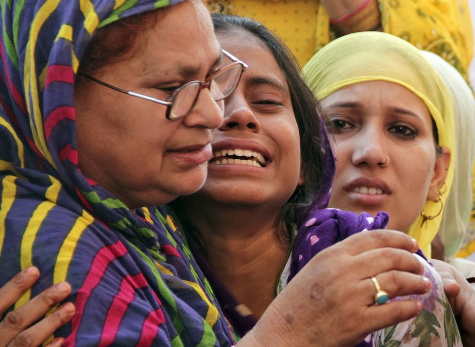 Relatives of Mohammad Akhlaq mourn after he was killed by a mob on 28, September 2015.