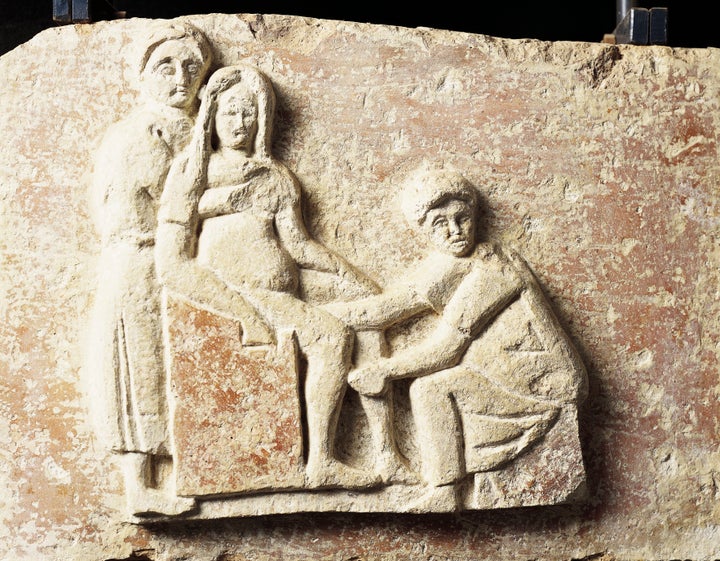 Relief depicting a scene of childbirth from the tomb of Scribonia Attica at the necropolis of Isola Sacra (Sacred Island) in Italy.