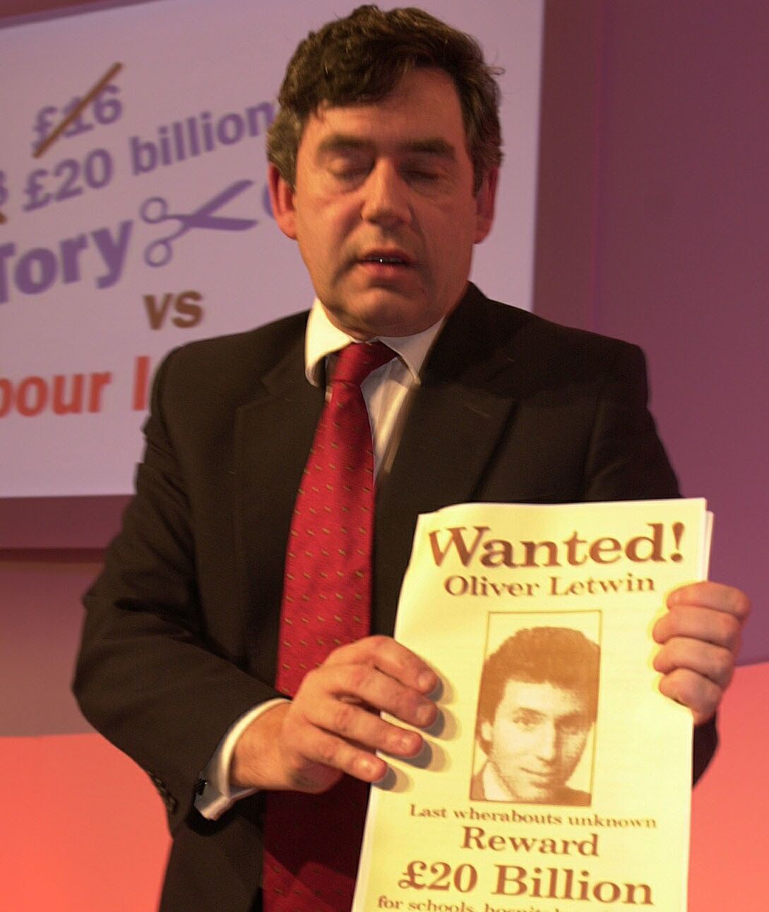 Gordon Brown with his 'Wanted' poster