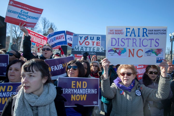 Demonstrators gathered outside the Supreme Court on Tuesday as the justices heard arguments in a closely watched case dealing