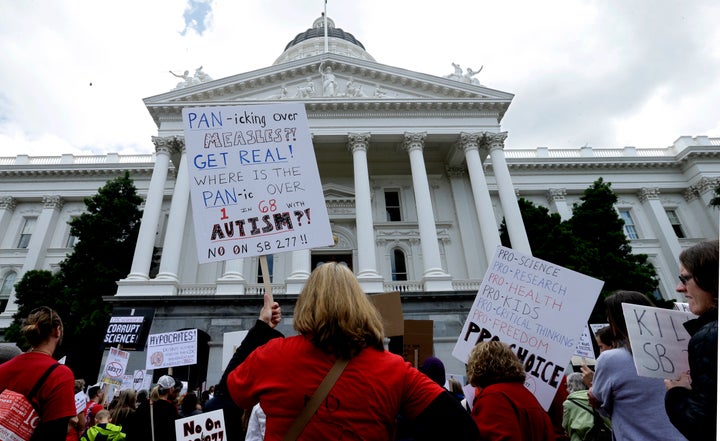 Anti-vaccine protesters demonstrate in front of the California Capitol in 2015, when Sen. Richard Pan's first vaccine law pas
