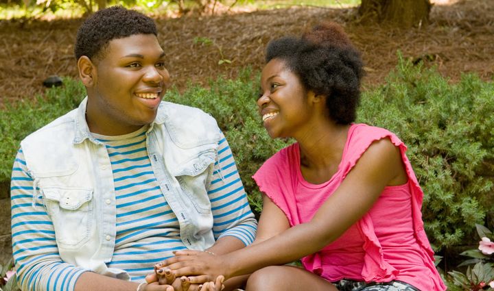 Smiling African American teenage couple
