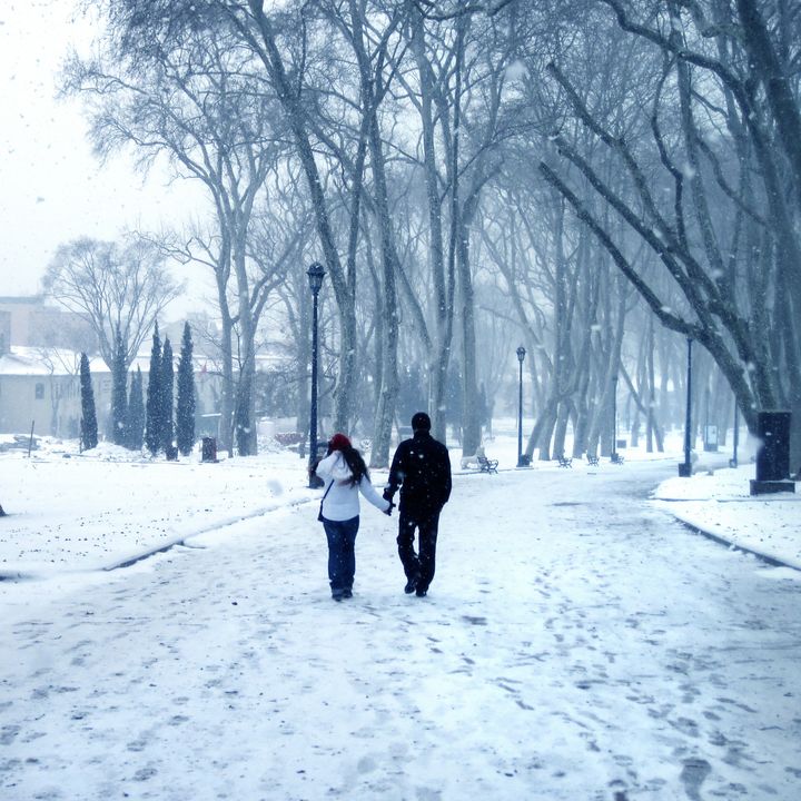 an image of the couple walking in winter time