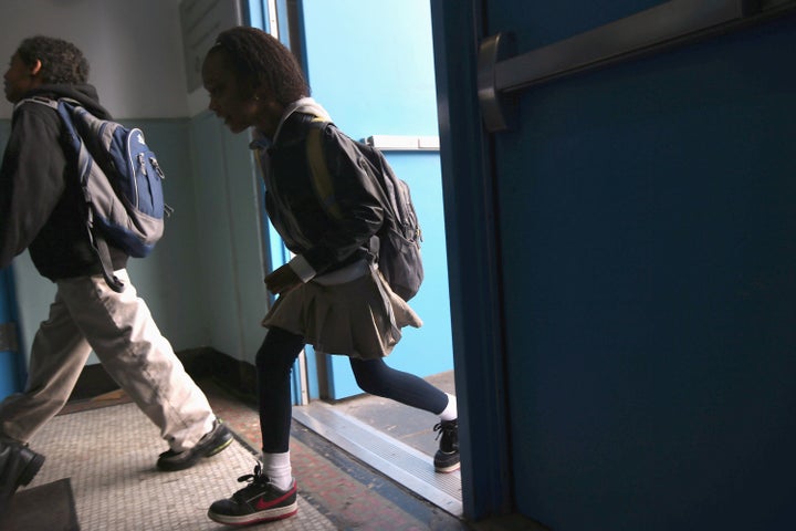 NEW YORK, NY - NOVEMBER 05: Students arrive to school on November 5, 2012 in the East Village neighborhood of New York, Unit