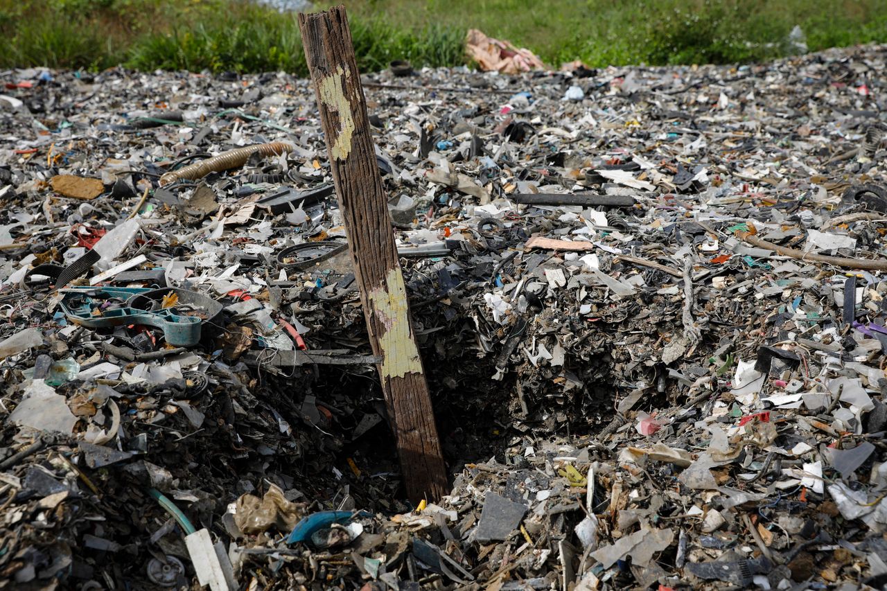 Plastics piles up at an illegal dumping site inside a palm oil estate in Kuala Langat on Feb. 2, 2019.