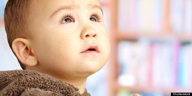 Portrait Of Baby Boy Wearing Warm Clothing at a library