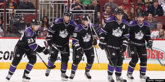 GLENDALE, AZ - MARCH 12: (L-R) Dustin Brown #23, Jake Muzzin #6, Slava Voynov #26, Anze Kopitar #11 and Justin Williams #14 of the Los Angeles Kings celebrate after scoring against the Phoenix Coyotes during the NHL game at Jobing.com Arena on March 12, 2013 in Glendale, Arizona. The Coyotes defeated the Kings 5-2. (Photo by Christian Petersen/Getty Images) 