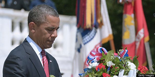US President Barack Obama places a wreath during a ceremony at the Tomb of the Unknown Soldier May 28, 2012 to mark Memorial Day at Arlington National Cemetery. Memorial Day is observed in remembrance for those died while serving in the US military. AFP PHOTO/Mandel NGAN (Photo credit should read MANDEL NGAN/AFP/GettyImages)