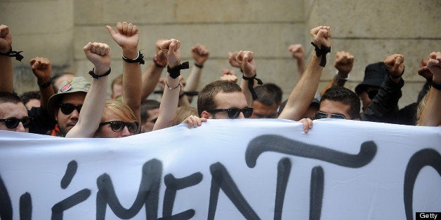 PARIS, FRANCE - JUNE 06: Left-wing militants pay tribute to Clement Meric who was attacked by skinheads on June 6, 2013 in Paris, France. Meric was reportedly left brain dead after a fight with skinheads thought to be associated with a small far-right group. (Photo by Antoine Antoniol/Getty Images)