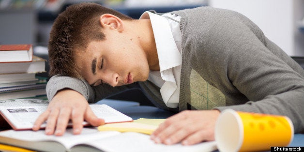 tired student sleeping at the...