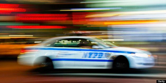 NYPD Police car moving through Time Square.