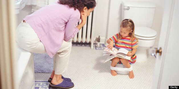 Mother potty training daughter (2-3), elevated view